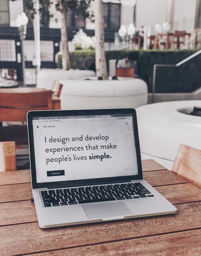 photo of laptop with hands above it.